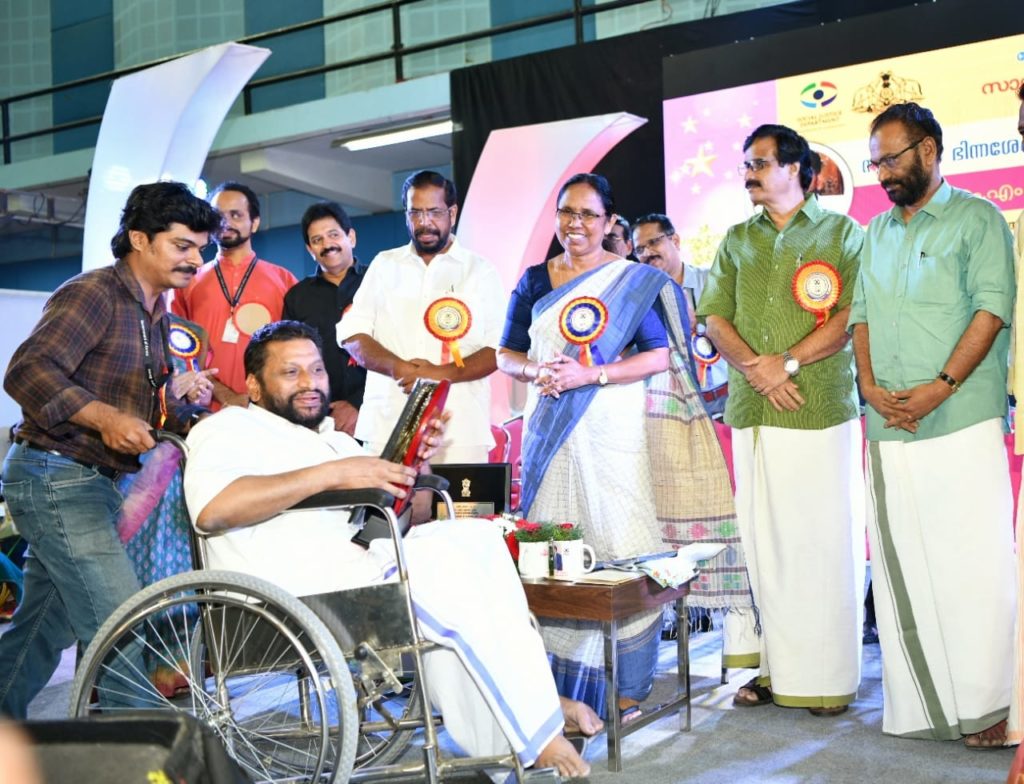 Receiving award from KK Shailaja - Minister for Health and Social Justice