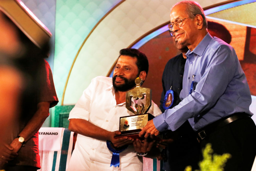 Receiving award from E. Sreedharan